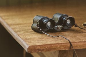 binoculars on a table