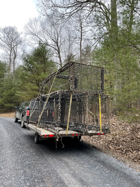 trailer loaded with Clover traps to be placed in storage