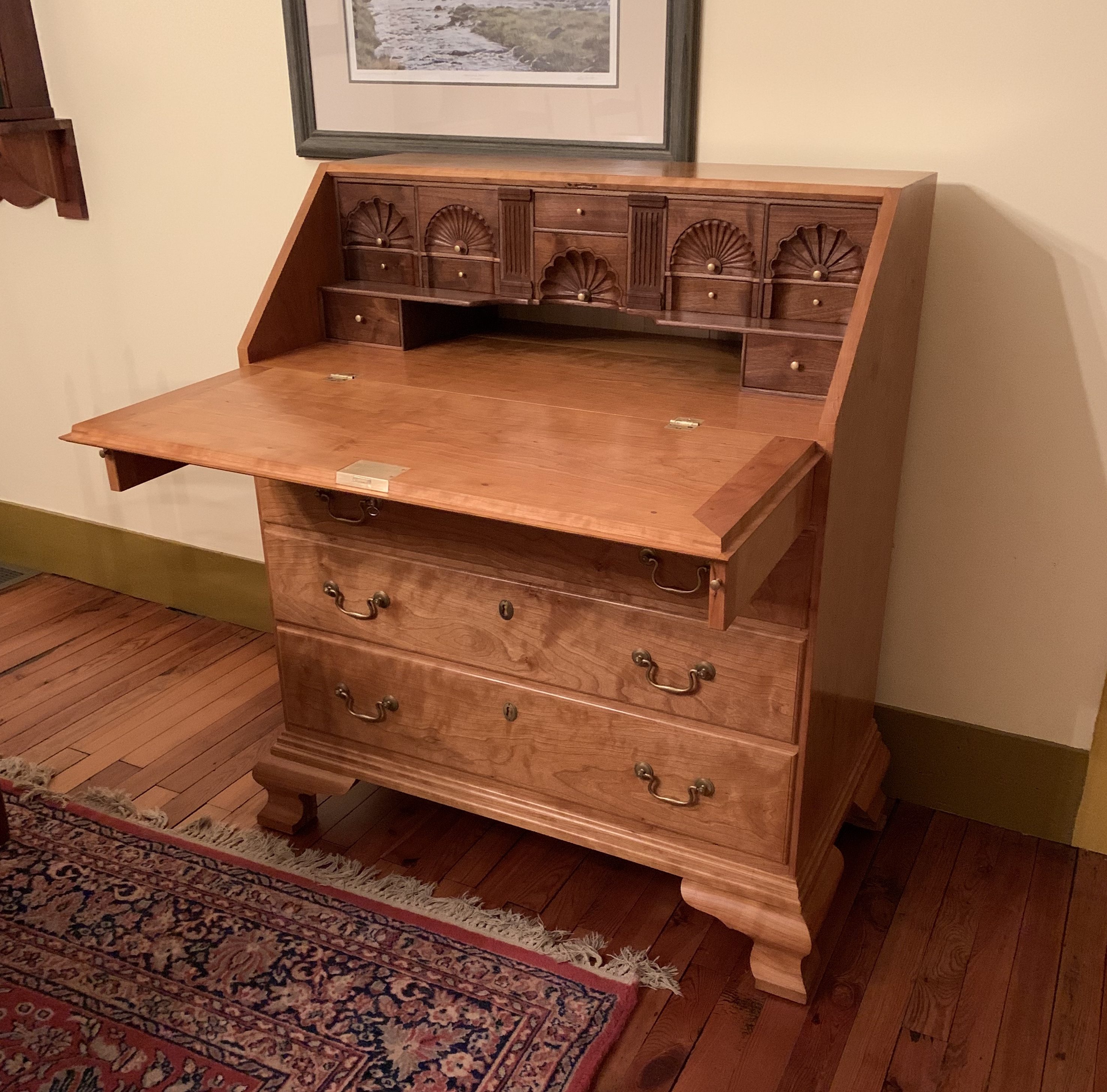 Secretary desk with hand carved interior draws