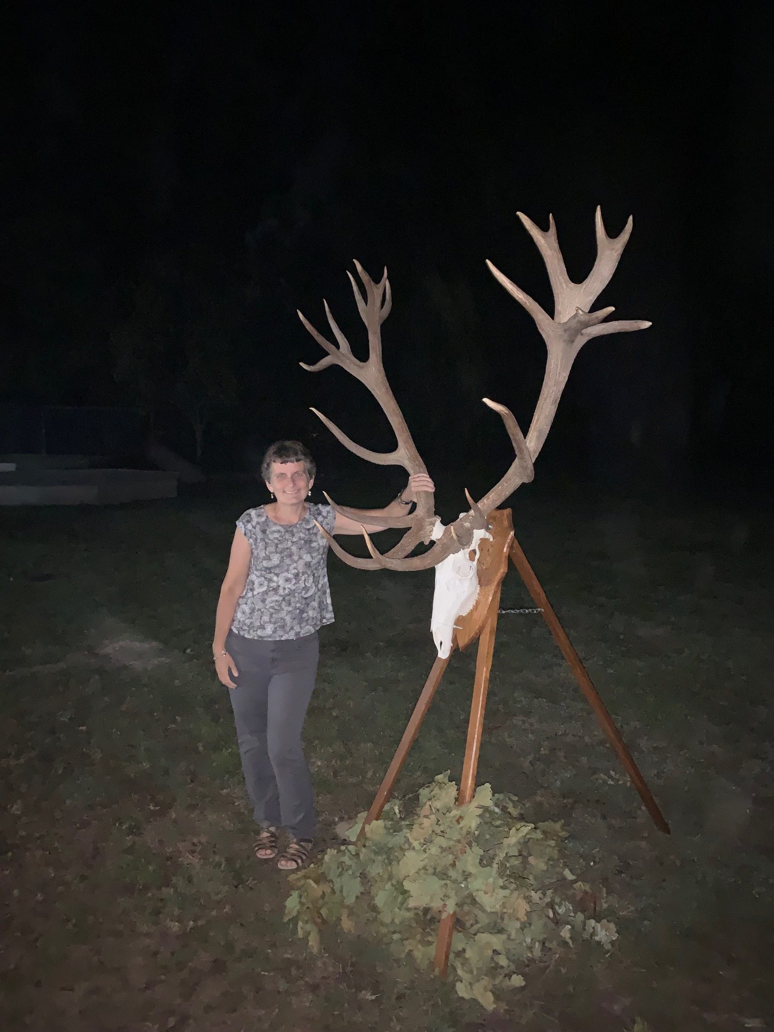 Lisa posing with elk antler rack on pedicle
