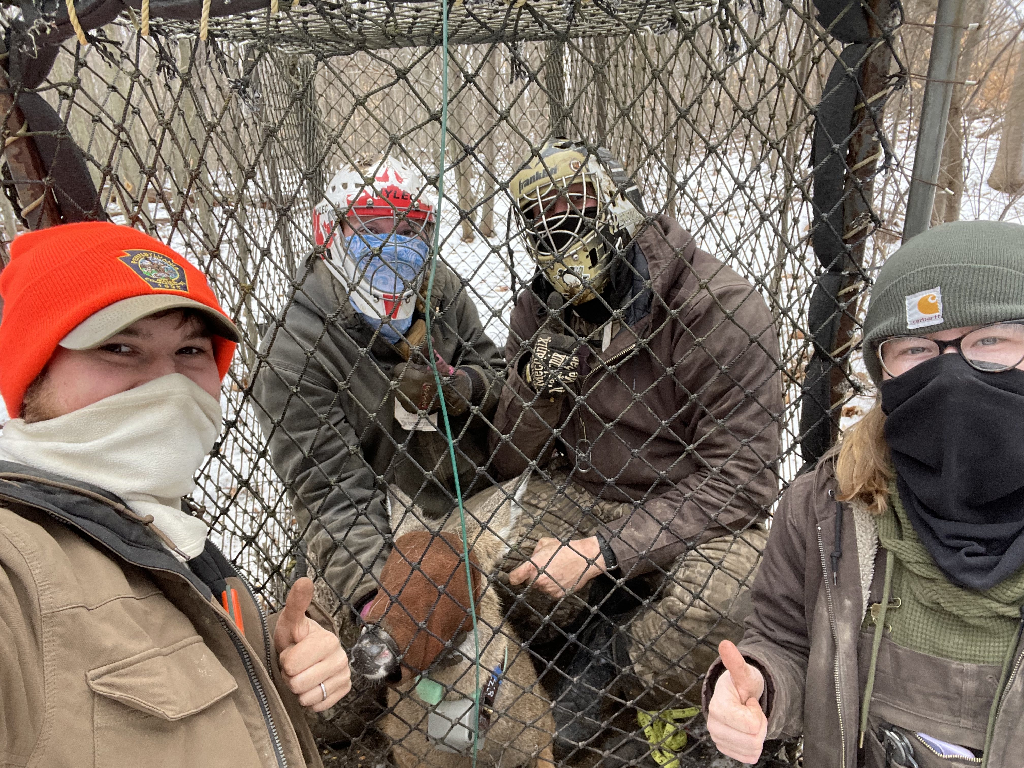 crew selfie with deer in Clover trap