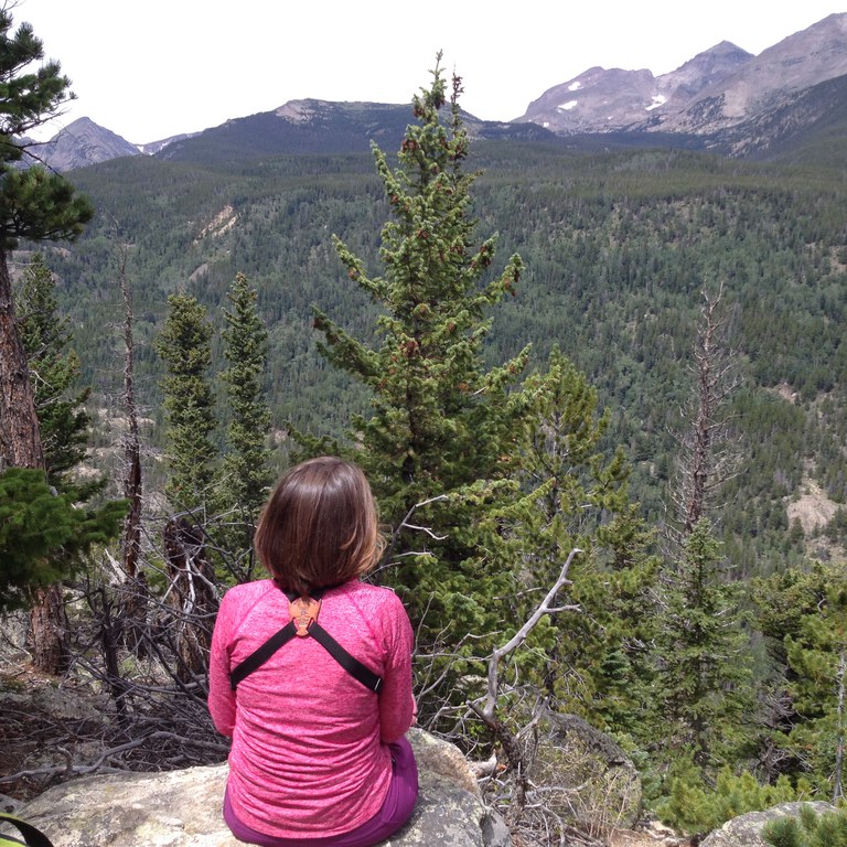 woman looking at vast mountainscape